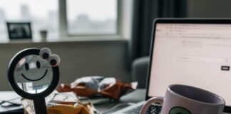 Cluttered desk with coffee mug and "navigational" sticky notes.